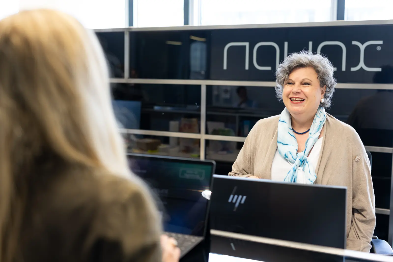 Receptionist talking with a visitor