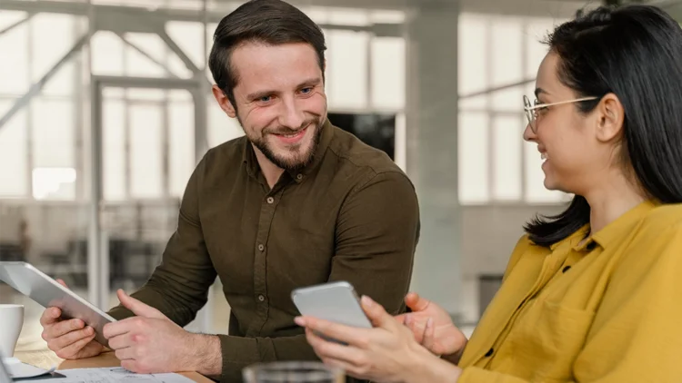 Business partners discuss current figures and plan measures