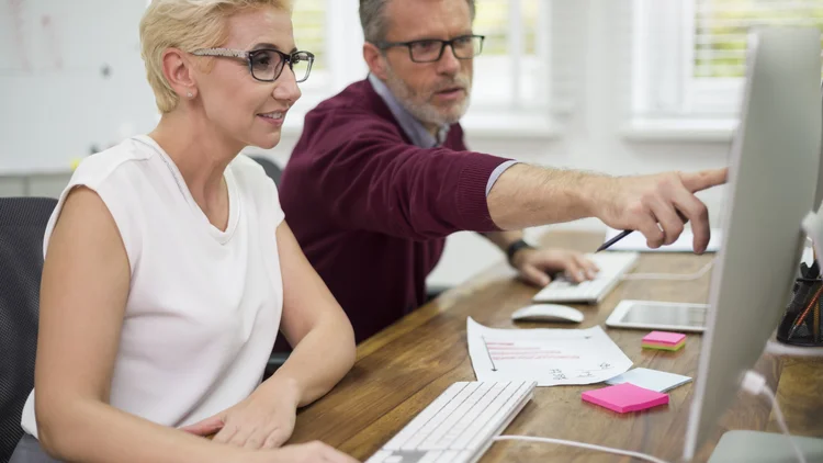 man-manufacturing-company-helping-his-partner-work